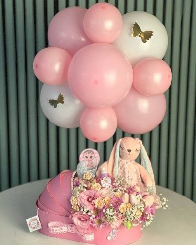 هدیه نوزادی گهواره صورتی با عروسک